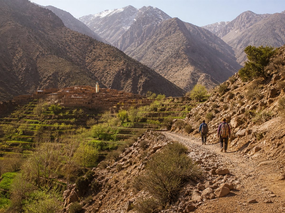 Amazigh village and hikers in the High Atlas Mountains